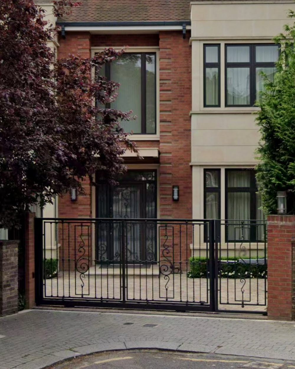 Wrought-iron gates and glazed front doors with decorative ironwork